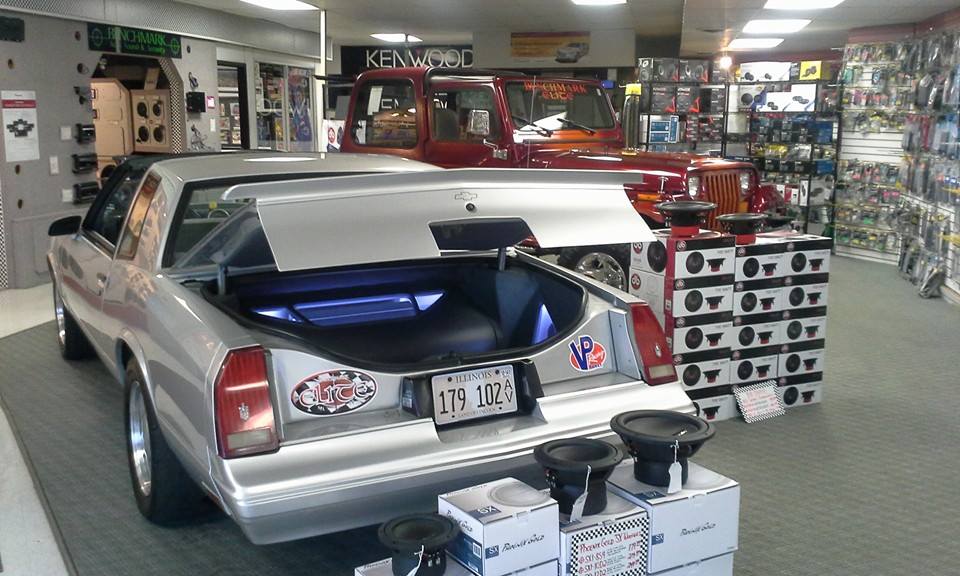 Silver sports car in the Benchmark Auto Sound shop